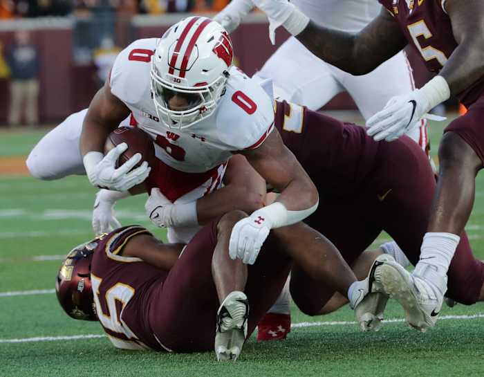 Wisconsin running back Braelon Allen pushing forward against Minnesota in 2021.